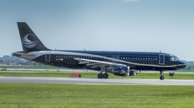 Airbus A320 (LY-COM) - Lining up for runway 23R takeoff