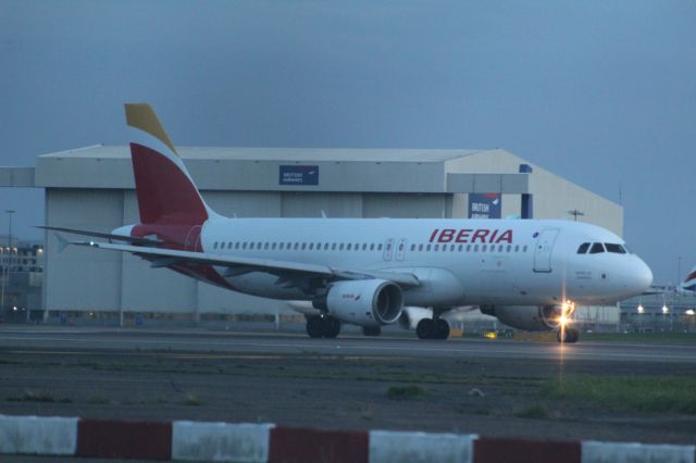 Airbus A320 (EC-ILS) - An Iberia A320 wearing the 'Puerto Rico livery' (not visible) lining up on runway 27R at LHR.br /br /Location: Northern Perimiter Road.br /Date: 27.10.22 (dd/mm/yy).