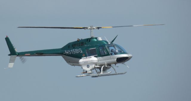 Bell JetRanger (N515BG) - Making a low pass is this 2002 Bell 206B JetRanger rotorcraft in the Spring of 2023.