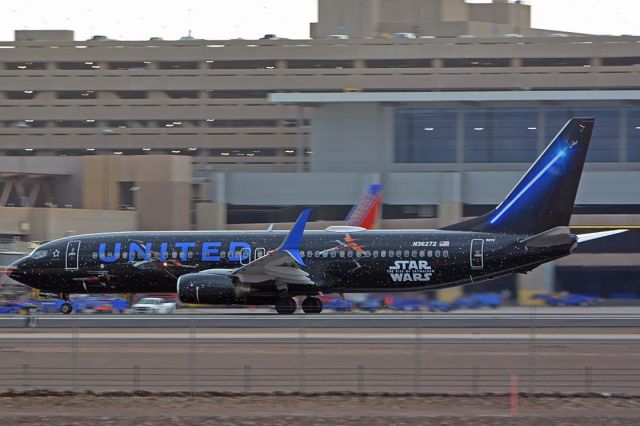 Boeing 737-800 (N36272) - United Boeing 737-824 N36272 Star Wars: The Rise of Skywalker departing from Sky harbor for Denver on its first visit to Phoenix in its new livery on NOvember 19, 2019. It features images of spacecraft from the First Order on the right side and spacecraft of the Resistance on the left side. The winglets, titles, and light sabres on the tail are red on the right side an blue on the left side.