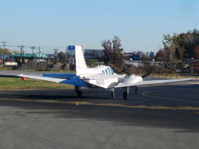 Beechcraft Baron (58) (N6311S) - Holding short of runway 24.