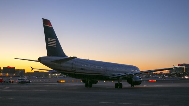 Airbus A321 (N540UW) - This Airbus 321 is moving past the C7 gates, getting ready to turn left onto taxiway Bravo to take off from runway 25R LAX, Los Angeles, California USA at 06:43 am 16 Jan 2015. It is flying to Philadelphia, Pennsylvania USA 