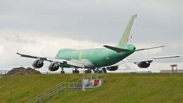 BOEING 747-8 (B-LJH) - BOE558 (LN:1457) on its takeoff roll on runway 34L on 6/14/12. Still in primer it will soon be painted in the livery of Cathay Pacific (CPA).