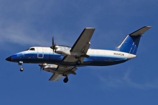Embraer EMB-120 Brasilia (N584SW) - BYA584 on short-final for RWY 24R this morning, 21 Feb 2022.