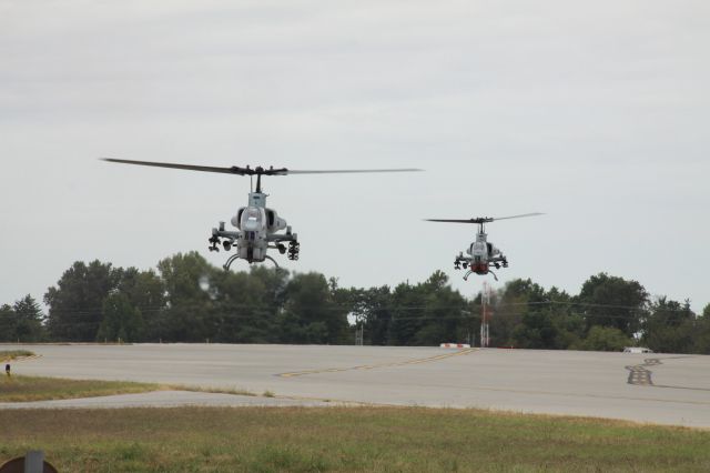 — — - 2 USMC Bell AH-1 SuperCobras taxing into KLEX. Helos from USMC HMA 269. Glad "Lawman 6" and "Lawman ?" recognized me as a friendly while I was taking this pic.