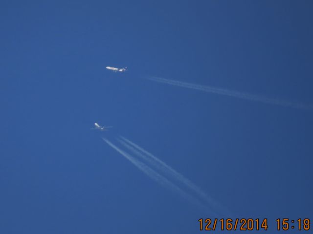 Boeing 747-400 (N477MC) - Atlas Air flight 2862 over the Southern Kansas and Missouri State Line at 38,000 with a FedEx MD-11 passing in front.