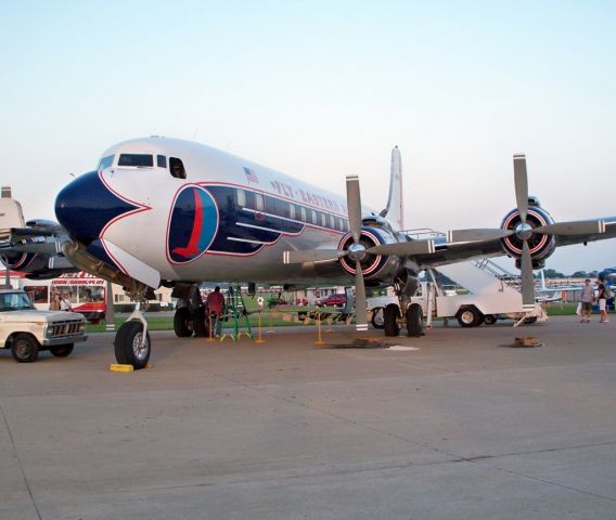 N836D — - Beautiful DC-7B seen at EAA Air Venture in her better days. No longer fkying.