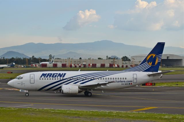 BOEING 737-300 (XA-MAI) - Boeing 737-322 XA-MAI MSN 24537 of Magnicharters taxiing for take off from Mexico City Airport (07/2018).