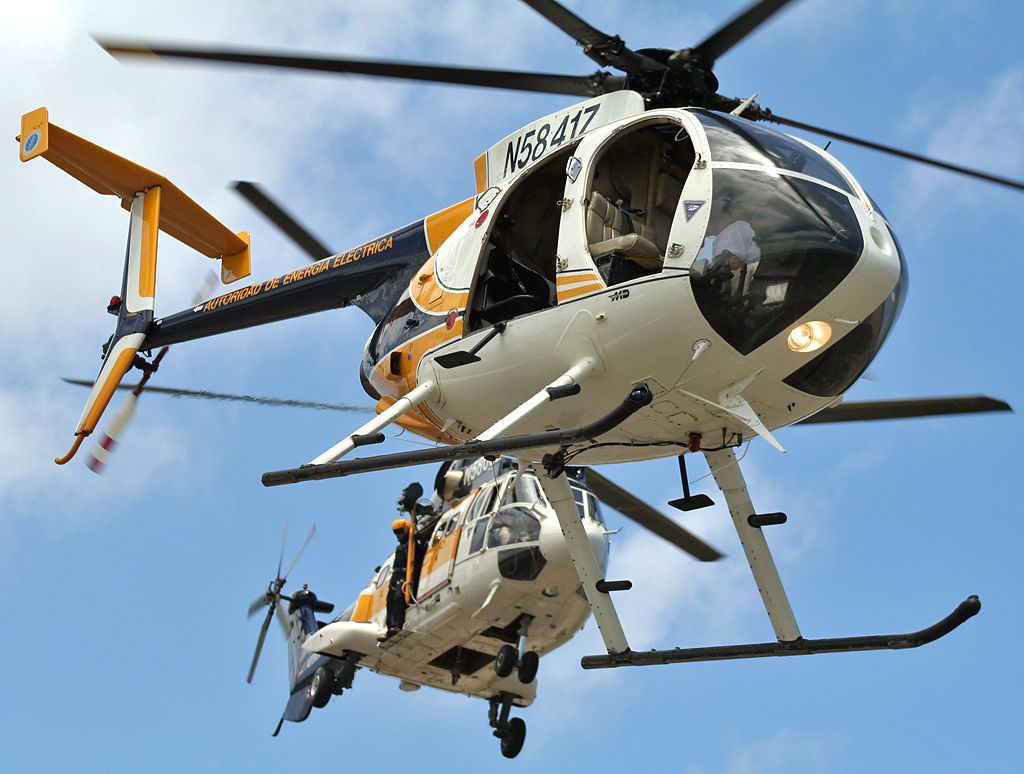 — — - Puerto Rico Electric Power Authority helicopters Super Puma AS332C (N5800Z) and MD530FF (N5841Z) taking off simultaneously