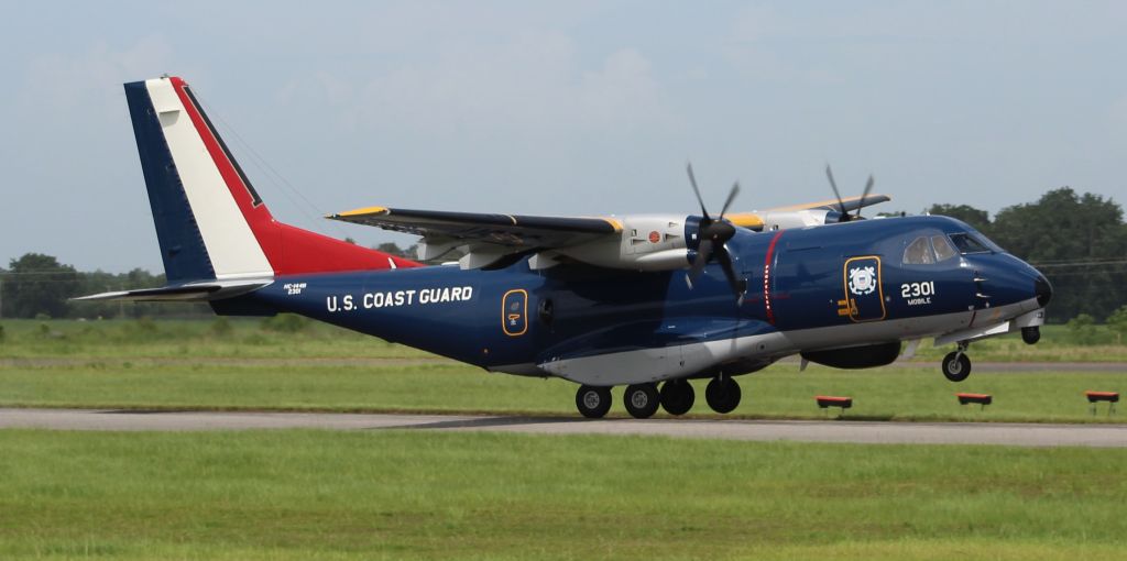 USCG2301 — - A U.S. Coast Guard CASA HC-144B Ocean Sentry during a series of touch and gos down Runway 19 at H.L. Sonny Callahan Airport, Fairhope, AL - June 21, 2018.