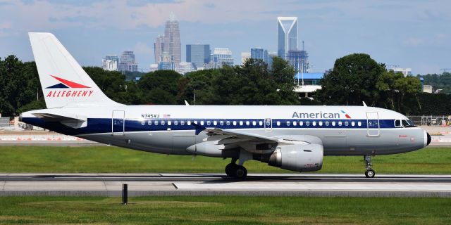 Airbus A319 (N745VJ) - Allegheny retro rolling down 18C, from the CLT overlook, 7/4/18.