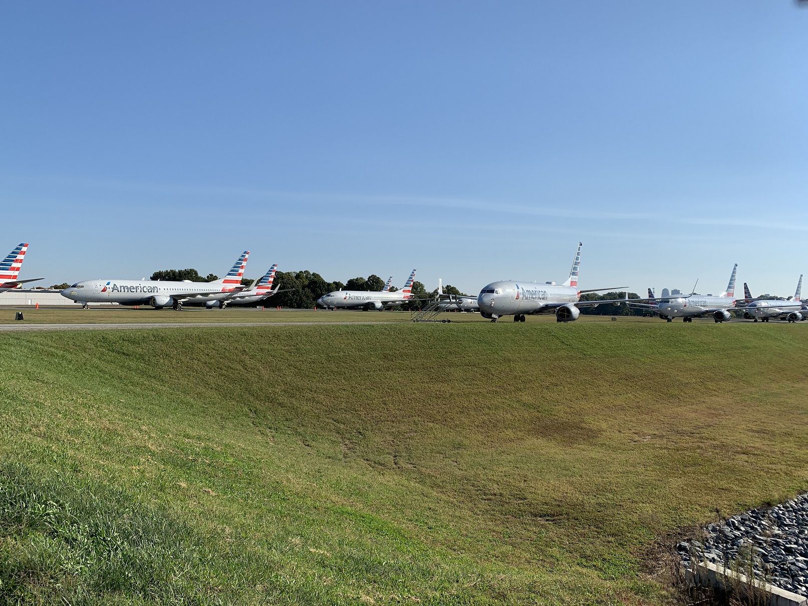 Boeing 737-700 — - Everyone! Hold Short.....Nope, just a bunch more American 37's stored at Smith Reynolds in Winston-Salem.