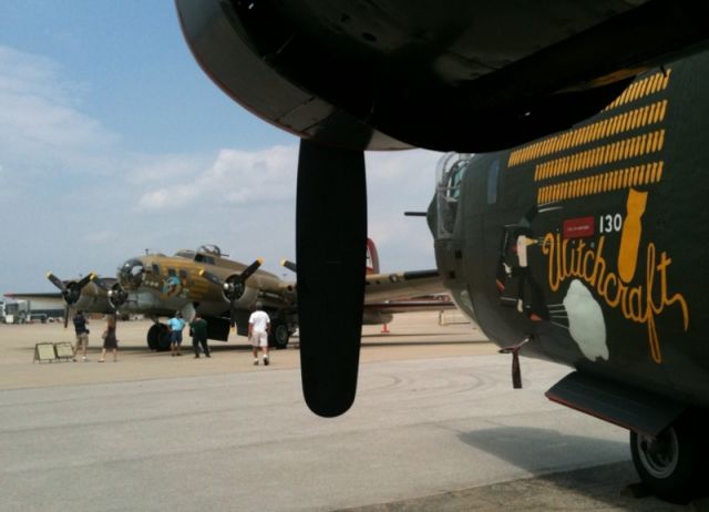 Boeing B-17 Flying Fortress (N93012) - "909" a restored B-17G, is framed by "Witchcraft", a restored B-24 at the Aviation Museum of Kentucky..... Thousands of people toured the historic bombers and "Betty Jane" (a P-51C touring with the bombers) during a recent visit to Lexington....