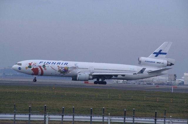 Boeing MD-11 (OH-LGC) - Departure at Narita Intl Airport Rwy34L on 1997/10/28 " Santa Claus c/s "