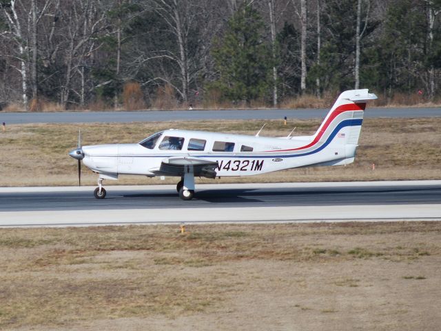 Piper Saratoga/Lance (N4321M) - Landing on runway 20 at Concord Regional Airport (Concord, NC) - 2/6/09