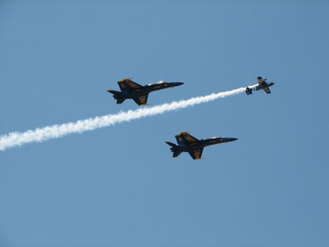 — — - 2 Blues f-18s and an Air National Guard plane fly over Duncan BC.