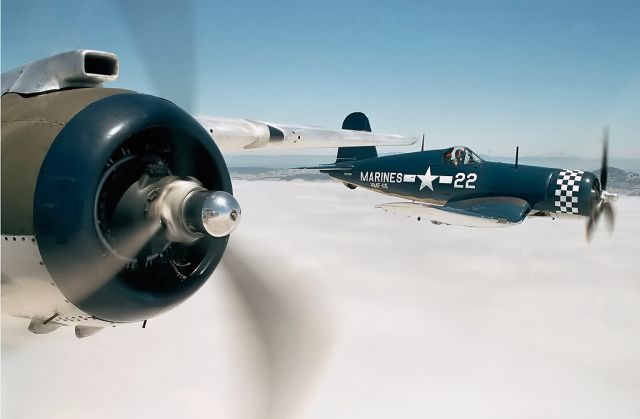 N700G — - A Goodyear FG-1D Corsair in very tight with the photo plane, the B-25J Pacific Princess, above a fog bank somewhere above San Francisco, CA.