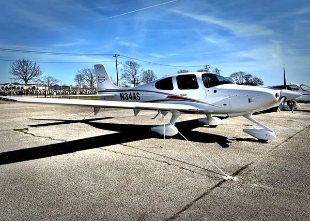 Cirrus SR-20 (N34AS) - This new Cirrus SR20 G6 is parked at FRG Republic's "A" tie-down ramp.