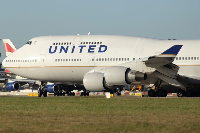 Boeing 747-200 — - United B747-400 lining up on runway 027L at LHR.