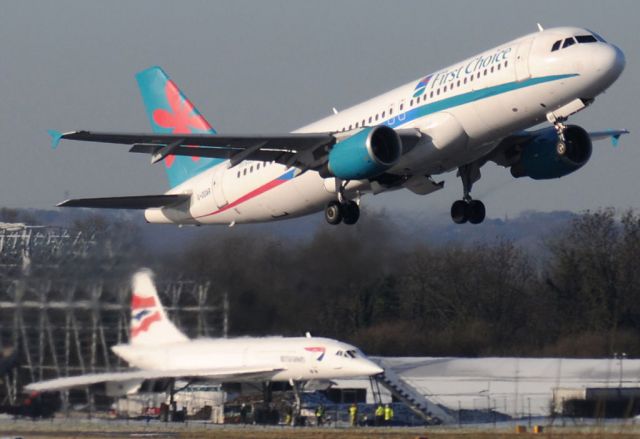 Airbus A320 (G-OOAR) - G-OOAR of First Choice lifts from RW05L , with Concorde G-BOAC in the background.  The new hangar to house G-BOAC can be seen under construction behind Concorde. 05.01.09