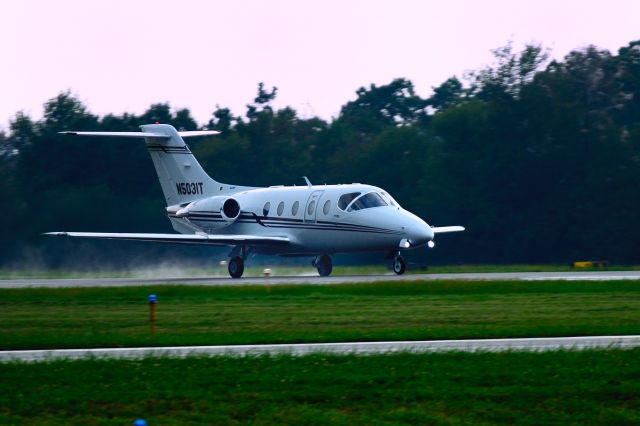 Beechcraft Beechjet (N5031T) - Departing Runway 8 in a light rain