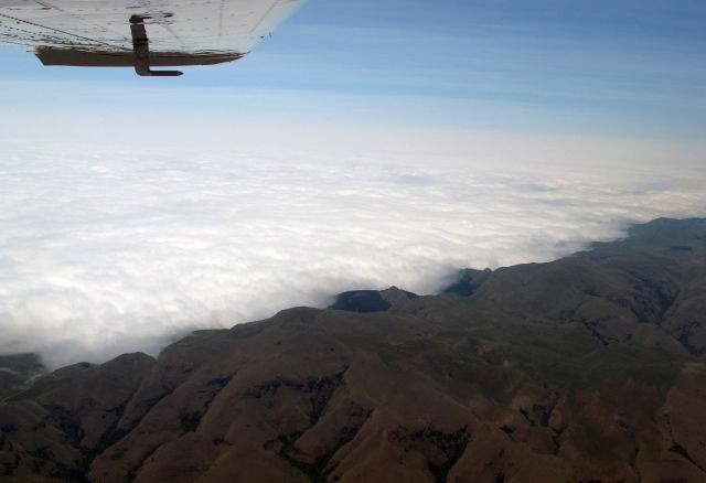 Cessna Centurion (ZS-AVB) - Crossing the Drakensberge, South Africa.