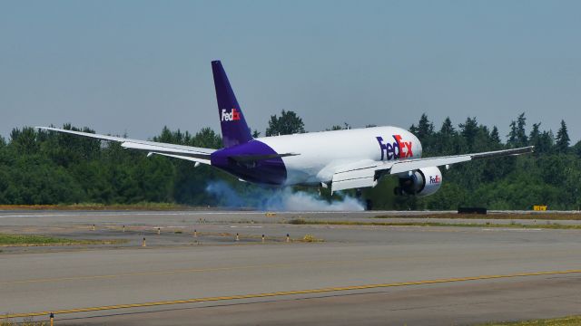 Boeing 777-200 (N870FD) - BOE301 touching down on Rwy 34L to complete a flight test on 6.27.21. (B777-FS2 / ln 1699 / cn 40676).