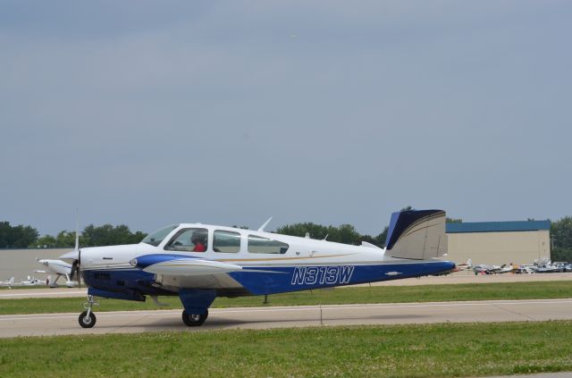 Beechcraft Bonanza (36) (N313W) - Bonanza mass arrival at AirVenture 2014