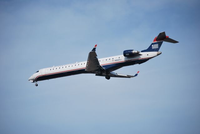 Canadair Regional Jet CRJ-900 (N922FJ) - Approaching runway 23 - 3/11/09