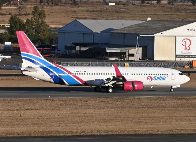 Boeing 737-800 (ZS-ZWX) - Fly Safair Boeing 737 800 landing at Lanseria Airport