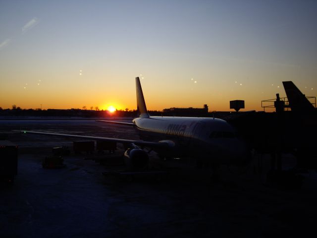 Airbus A319 — - Waiting to depart in the last cold light of day