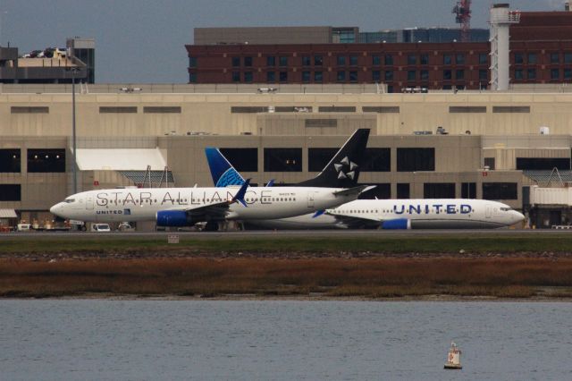 Boeing 737-800 (N14219) - United B738 in Star Alliance livery departing BOS followed by another United on 11/21/21. 