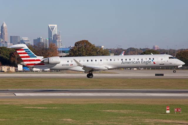 Canadair Regional Jet CRJ-900 (N591NN) - landing on runway 18C at approximately 3:56 PM