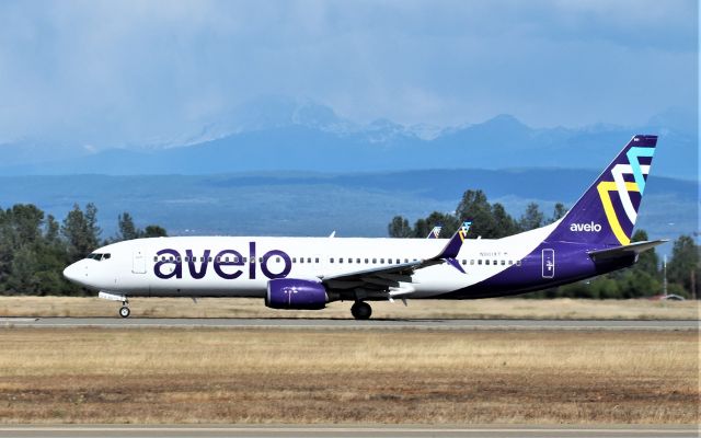 Boeing 737-800 (N801XT) - KRDD - Inaugural Flight RDD-BUR for AVELO airlines departing Runway 34 at Redding shown passing Lassen Volcanic National Park 45 miles in the background. Yes it was snowing this day May 20, 2021 in the hills east of Redding all the while a nice balmy 75 degrees in Redding. AVELO  Airlines launched 1st ever Boeing 737-800 service for Redding on a 3x per week flight service. Both flights were full/nearly full.