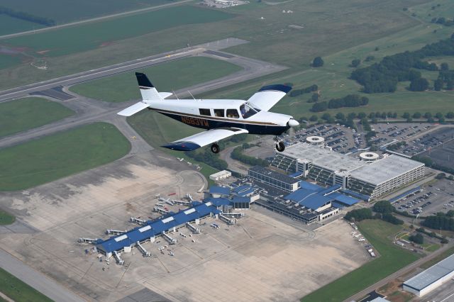 Piper Saratoga (N563VW) - N563VW over the top of the terminal at Huntsville International Airport (KHSV)!