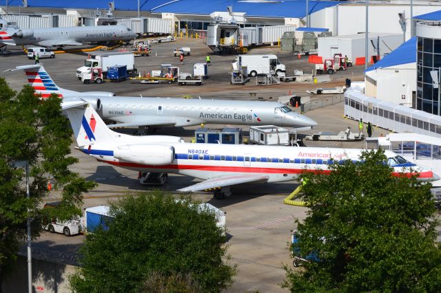 Embraer ERJ-145 (N840AE) - American Eagle fraternal twins parked at KCLT - 9/22/18