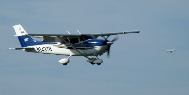 CESSNA T182 Turbo Skylane (N1437R) - On short final is this 2004 Cessna T182 Turbo-Skylane. Also making the photo on left downwind is the next photo N67MT Falcon 50EX in the Summer of 2023.