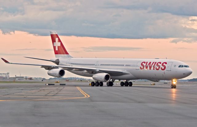 Airbus A340-300 (HB-JMO) - Hot Swiss sunset arrival @ KBOS Logan Airport Boston,Ma