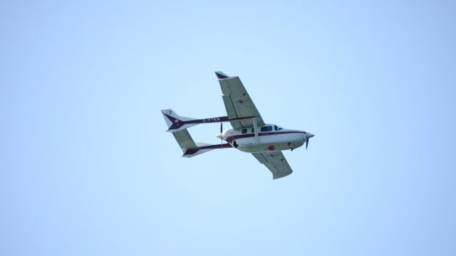 Cessna Super Skymaster (C-FTES) - Watched it fly a F1 racetrack over the area