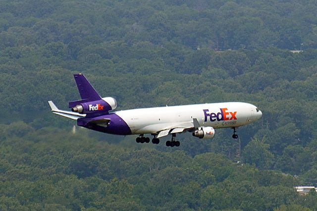 — — - Fed Ex jet landing at Memphis International Airport