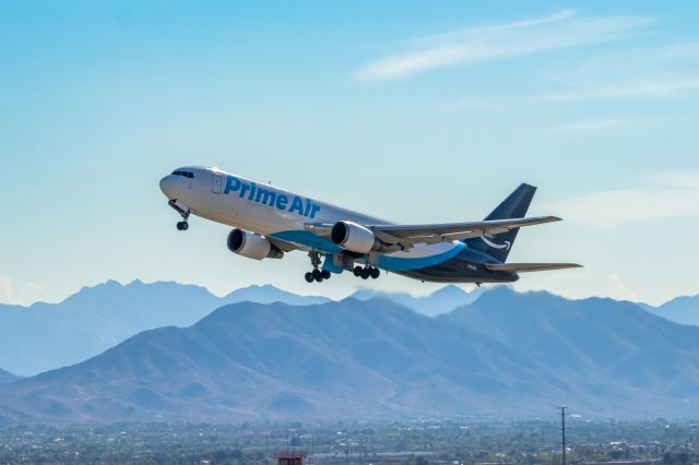 BOEING 767-300 (N1049A) - Prime Air 767-300 taking off from PHX on 9/27/22. Taken with a Canon 850D and Rokinon 135mm f/2 manual focus lens. 