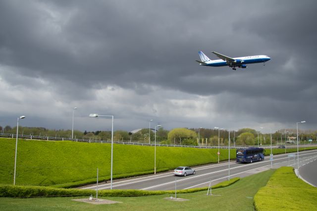 Airbus A330-200 — - United B767-300ER approaches runway 09L at LHR.