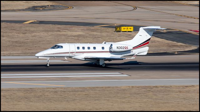 Embraer Phenom 300 (N302QS) - Netjets landing at DAL.