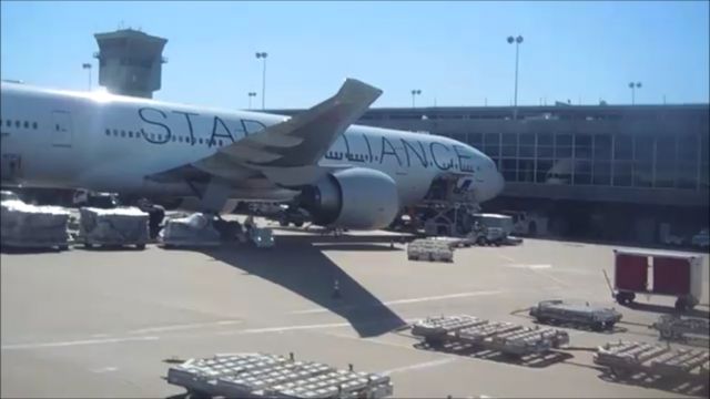 BOEING 777-300ER (JA731A) - Welcome to Dulles International on a Sunny Late-Morning, An All Nippon Airways Boeing B777-300ER painted in the Star Alliance Livery is serviced in September 2017, note the Front of the aircraft is seen being reflected onto the Shiny Hanger Windows!