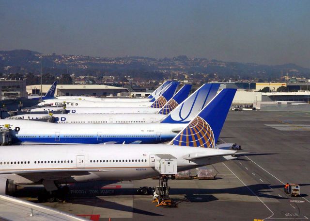 Boeing 777-200 (N227UA) - KSFO_ United dock at SFO taken from the upper deck Tramway. A nice mix of 747s and 777s in various United liveries.