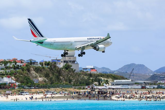 Airbus A330-200 (F-GZCB) - Air France Airbus A330-200 F-GZCB over maho beach thrilling the beach goers before landing at TNCM St Maarten.br /27-06-2018