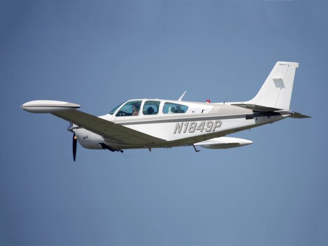 Beechcraft Bonanza (33) (N1849P) - A very nice F33 Bonanza with tip tanks. Take off runway 26.