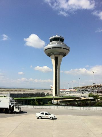 — — - Madrid-Barajas control tower, taken from walk-up boarding of Iberia A340-600 to JFK.