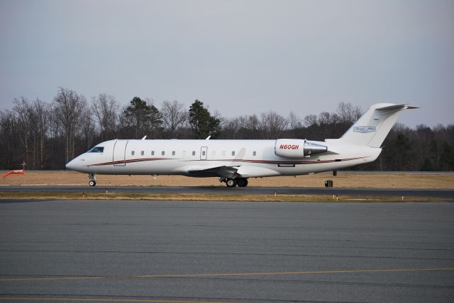 Canadair Regional Jet CRJ-200 (N60GH) - STEWART-HAAS RACING LLC taxiing to runway 20 at KJQF - 2/10/09