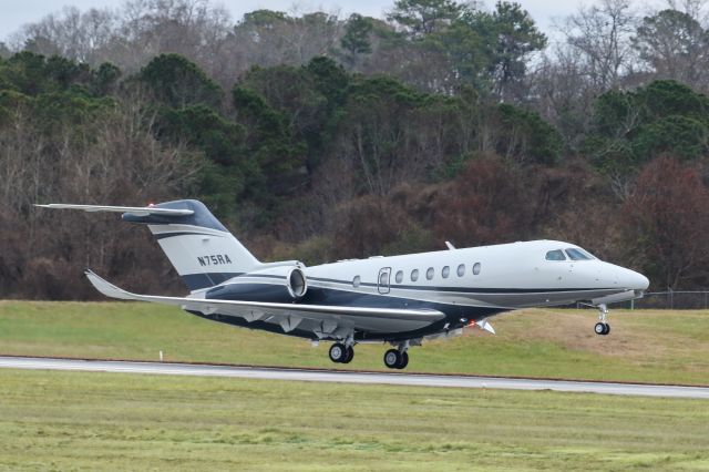 Cessna Citation Longitude (N75RA) - This is a photo of a 2020 Textron 700 departing Atlanta's PDK executive airport. I shot this with a Canon 100-400 IS II lens. The camera and lens settings were 300mm, 1/2000 shutter, F6.3 ISO 1000. I really appreciate POSITIVE VOTES & POSITIVE COMMENTS. Questions about this photo can be sent to Info@FlewShots.com